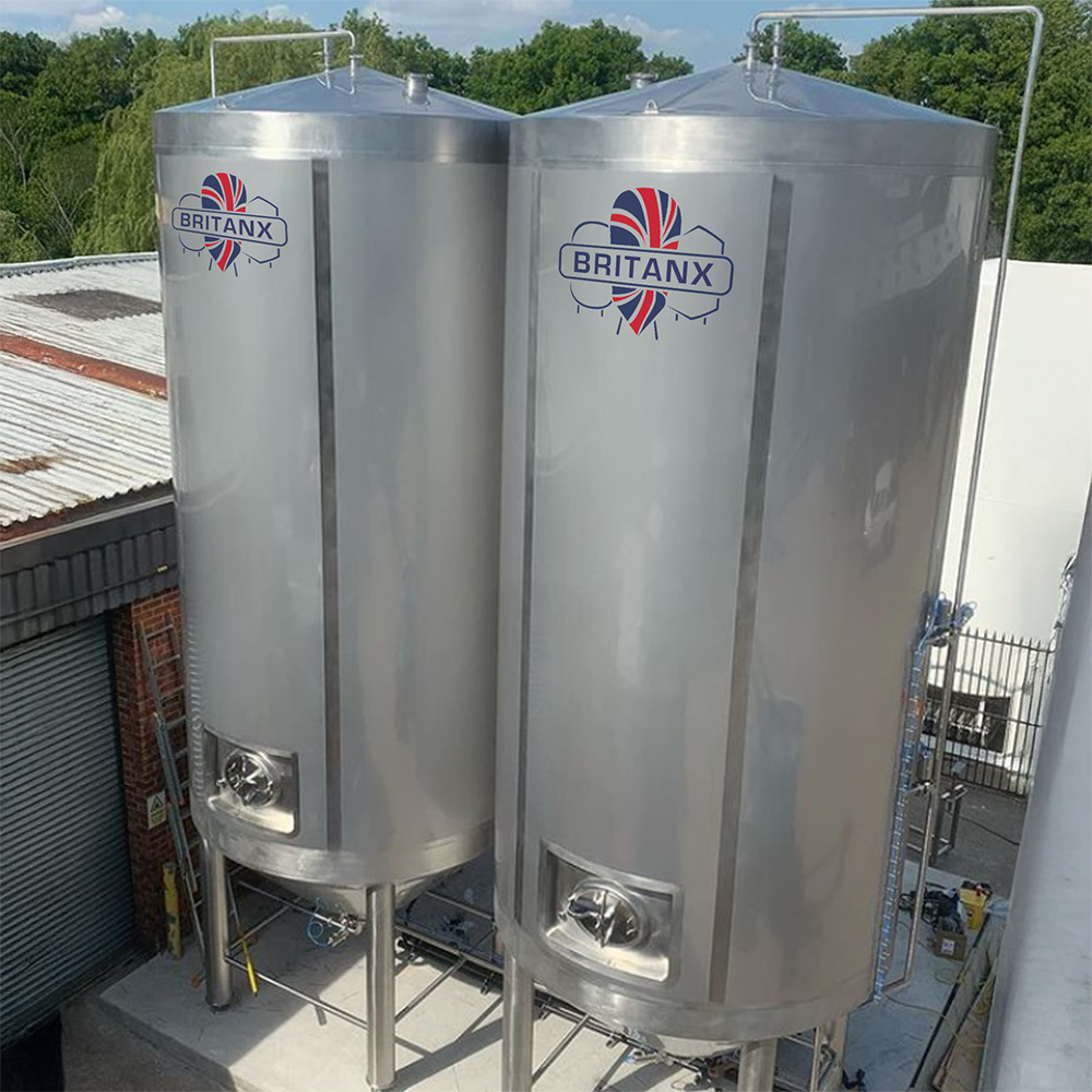 Twin 30,000 litre stainless steel brewery vessels installed on customer site for beverage processing and storage